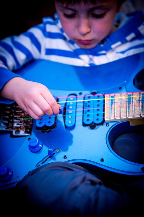 boy playing guitar